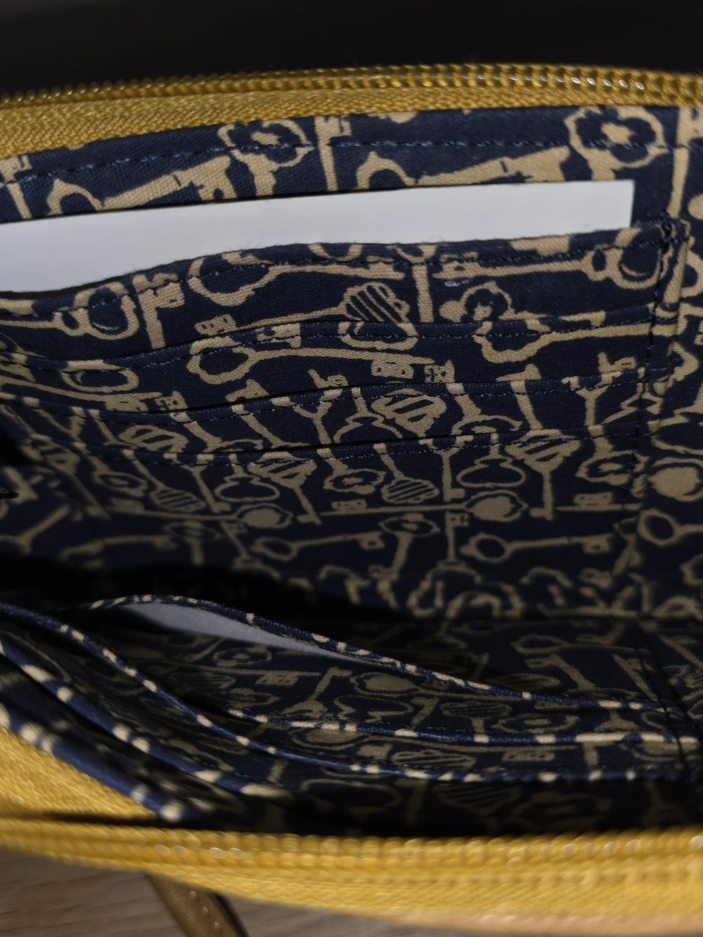 Fossil Mustard Yellow Wristlet with Embroidered Bird & Cage Motifs